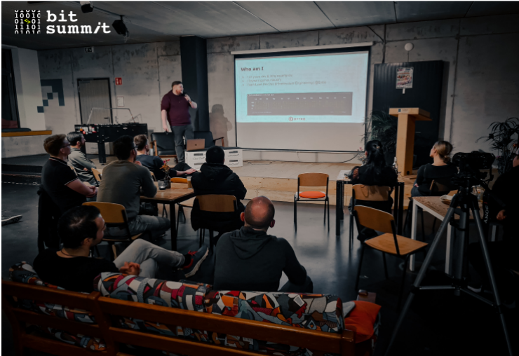 A man presenting to a group of people about DevOps