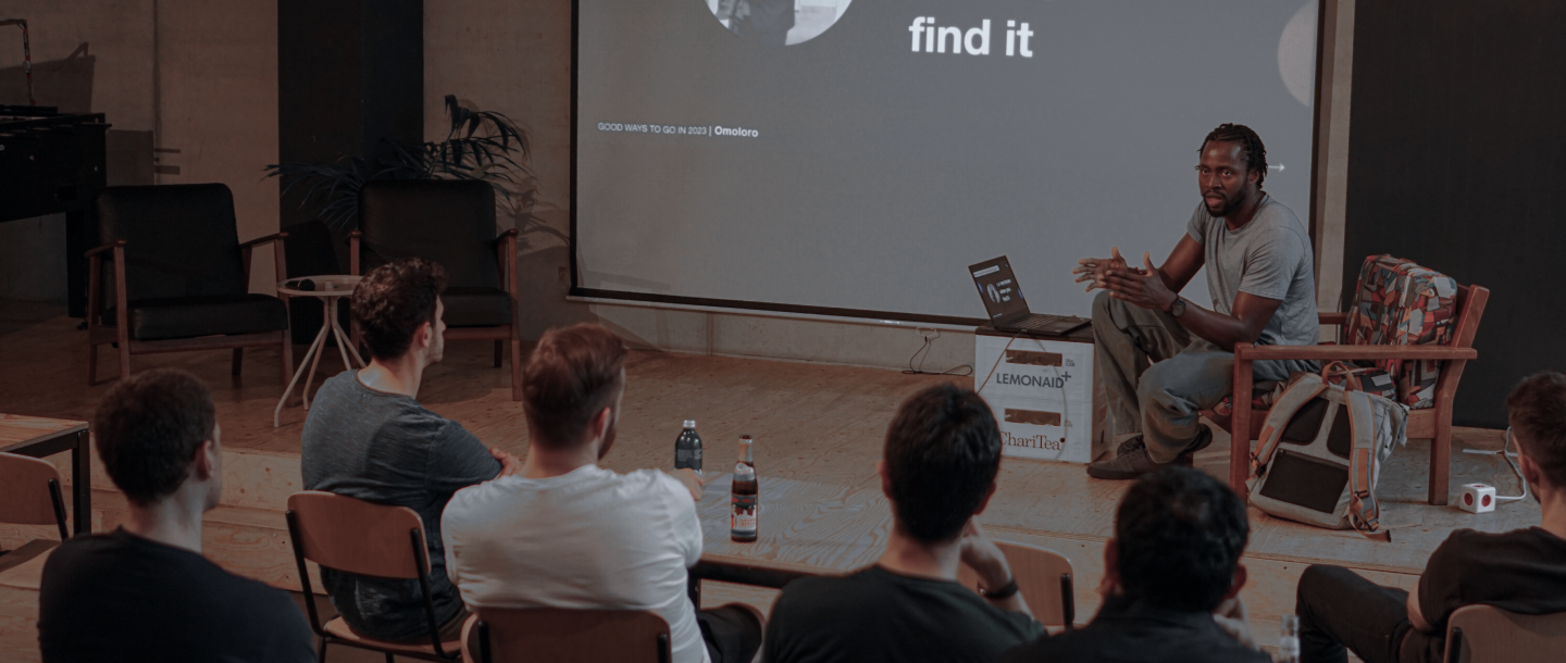 A man presenting to a group of developers on bit summit event