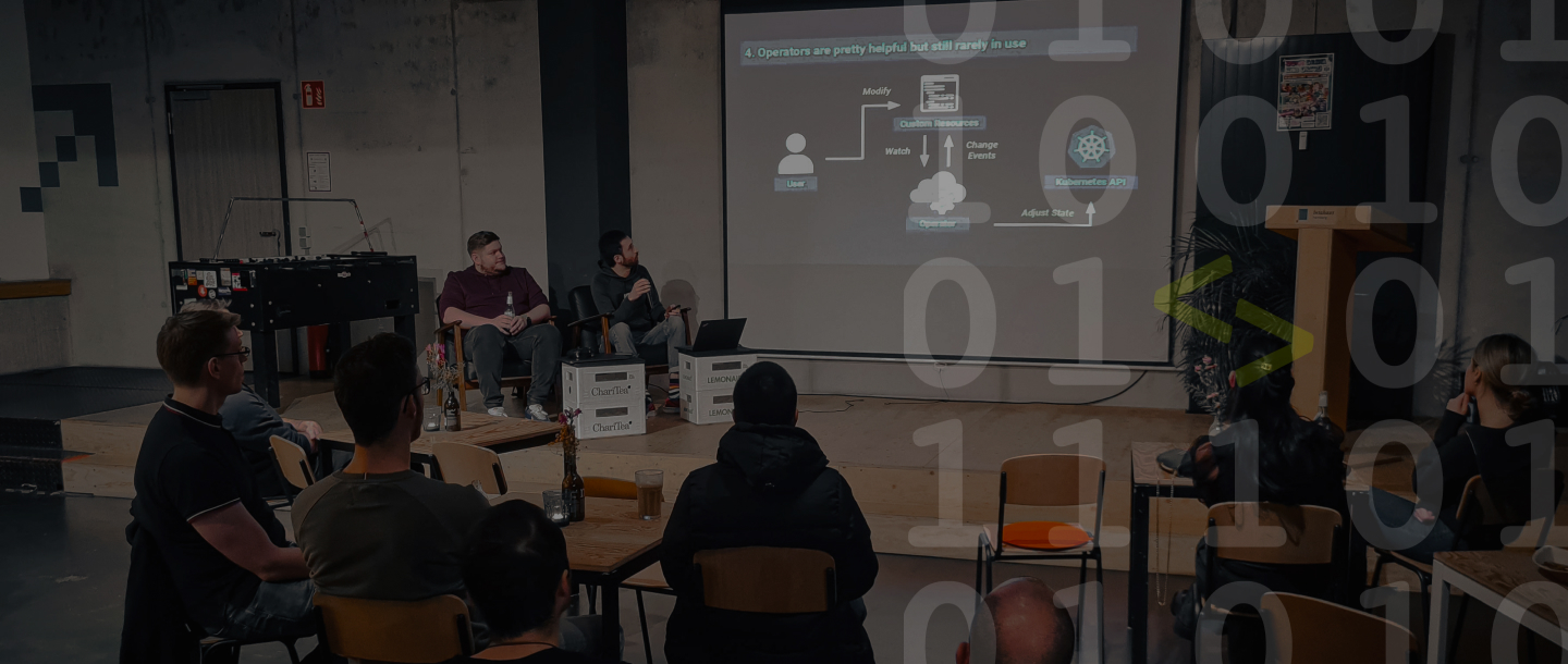 Two developers presenting to a group of people on the bit summit event